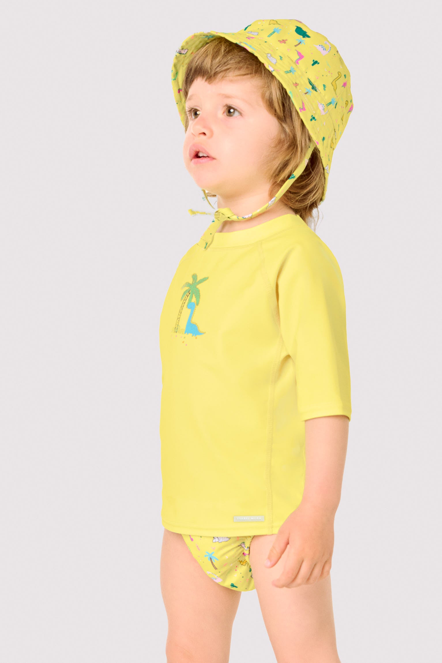 Camiseta de banho infantil com estampa de dinossauro e palmeira