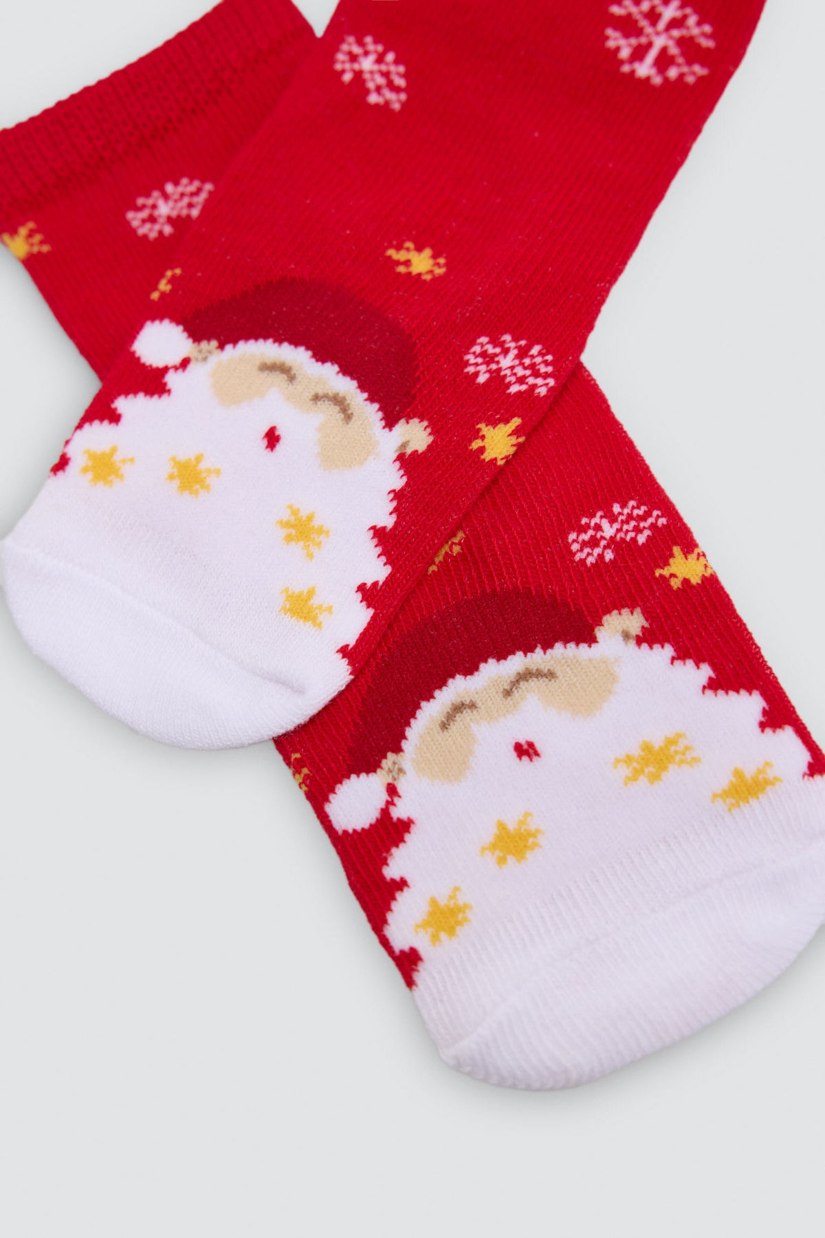 Pack de 2 meias de bebé de Natal com renas e Pai Natal