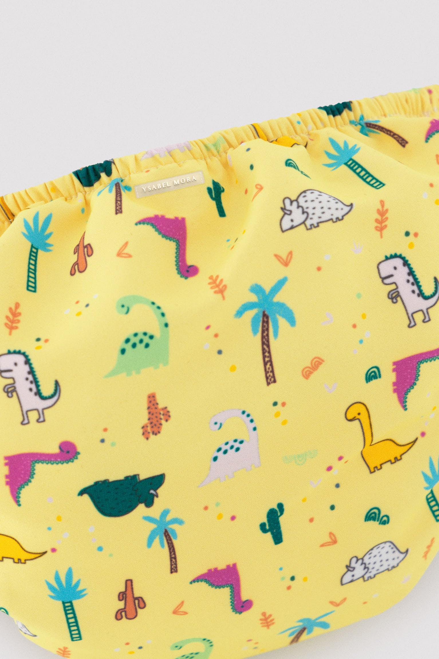 Fralda anti-vazamento para bebês com estampa de dinossauro.